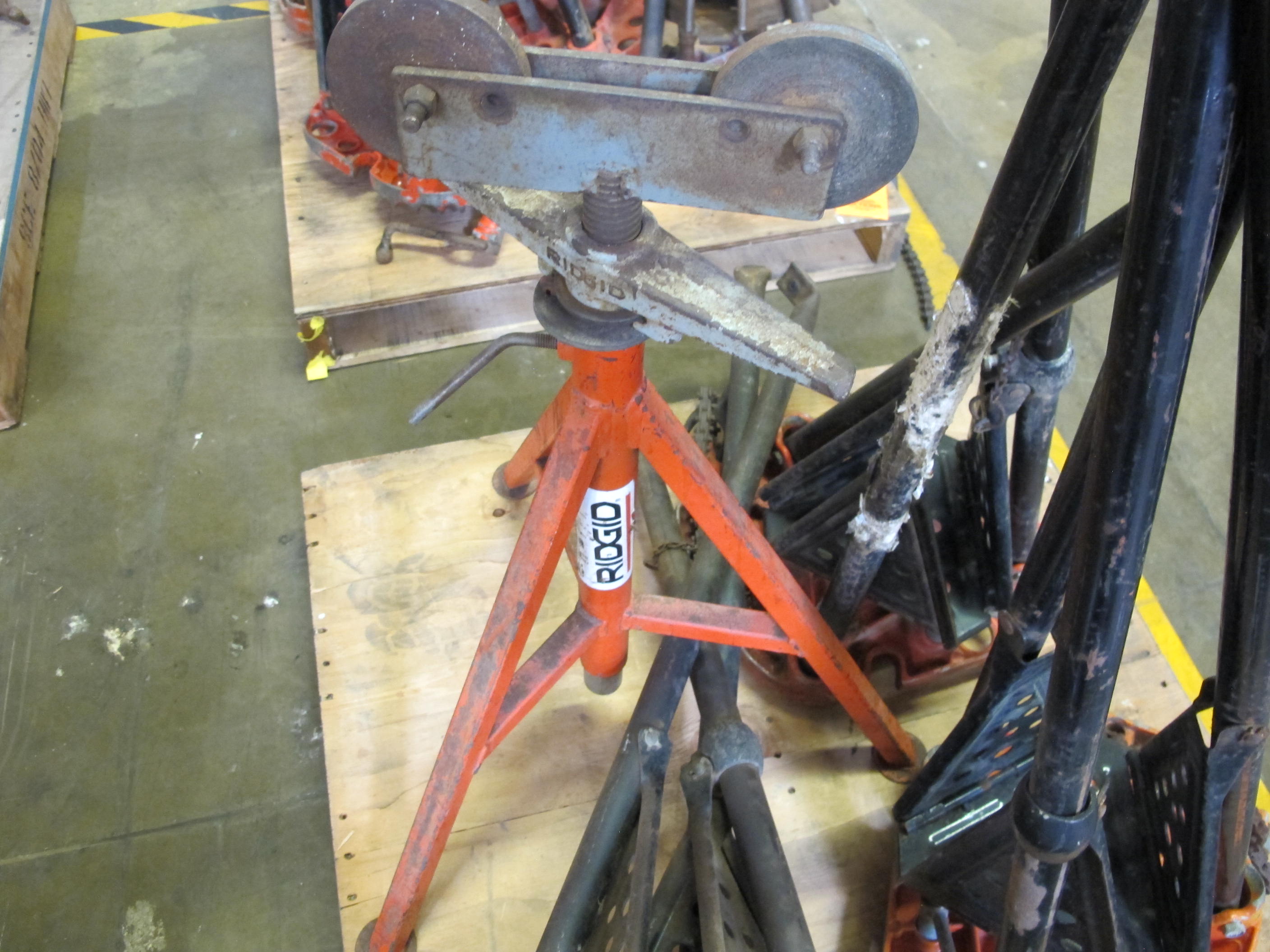 LOT TO INCLUDE: (1) RIDGID TRI-STAND/PIPE ROLLER, (3) RIDGID TRI-STANDS. LOADING & HANDLING FEE $15-4024